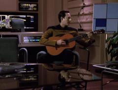 Data playing guitar