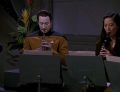 Data playing oboe